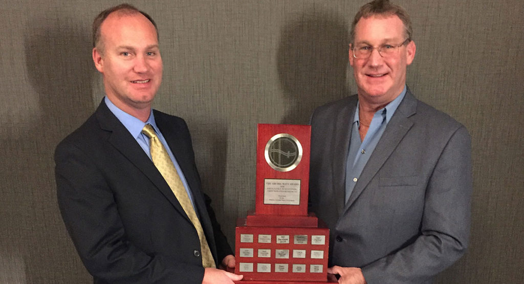 photo of jamie and rob mackinnon with the archie watt award